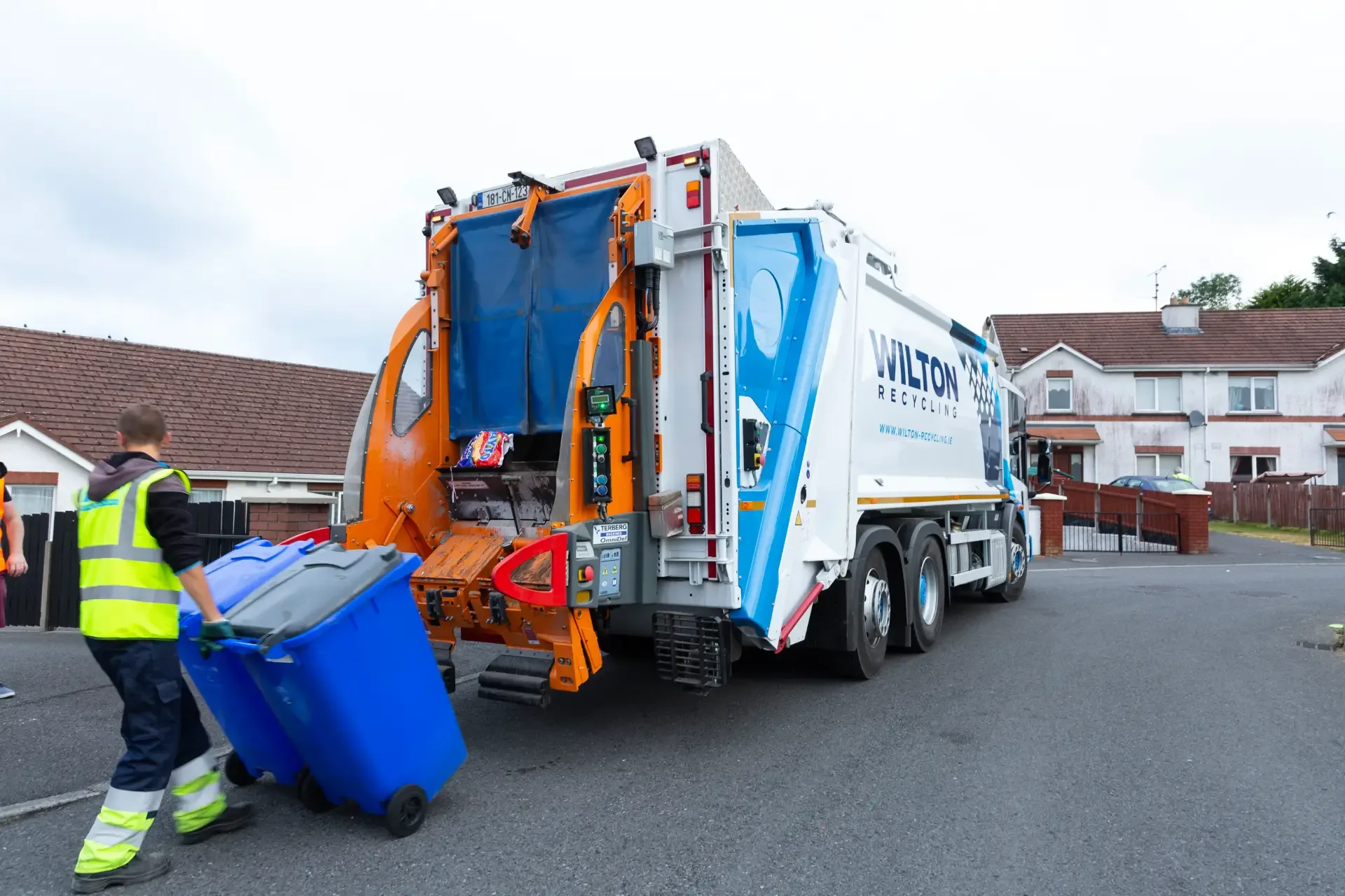 household wheelie bin collection truck