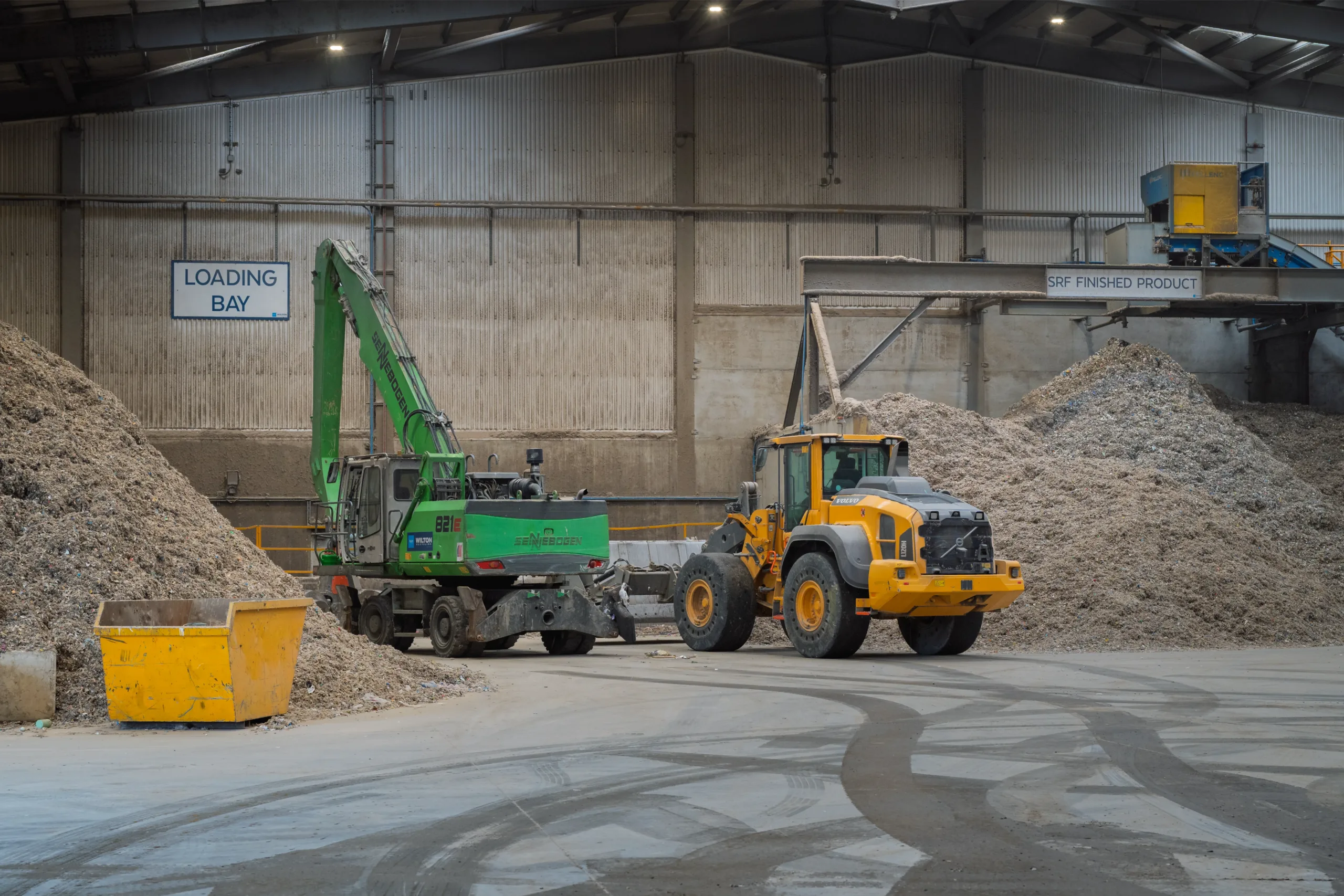solid recovered fuel sennebogen and volvo machinery inside facility